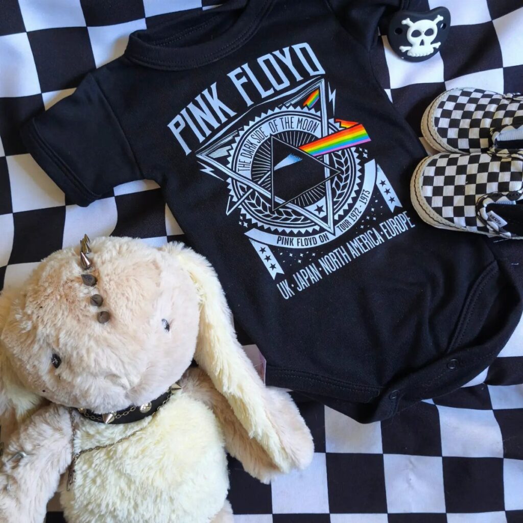 Pink Floyd baby bodysuit with checkered shoes and a spiked collar plush bunny.