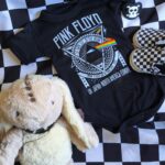 Pink Floyd baby bodysuit with checkered shoes and a spiked collar plush bunny.